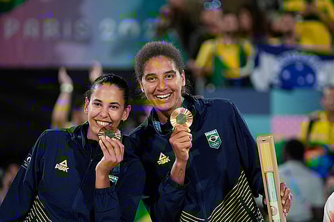 Paris Olympics Women's beach volleyball: Brazil's Eduarda "Duda" Santos Lisboa, left, and Brazil's Ana Patricia Silva Ramos pose with their gold medals